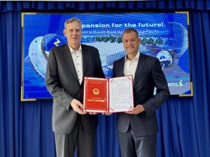  Alexander Reich (left), Managing Director, Ziehl-Abegg Vietnam, and Joachim Ley with the certificate of registration for the new company