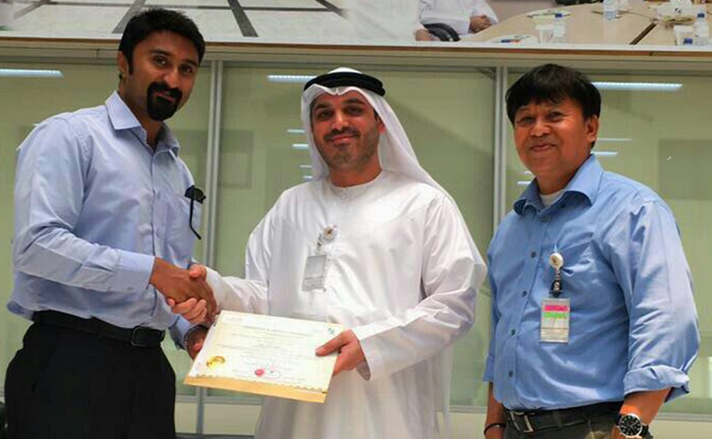 L-R: Umesh Unni from Hira Industries receives the DCL Certification from Arif Husain Al Marzooqi and Toreno Francisco of Dubai Municipality