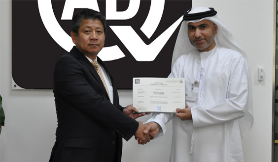 Ryoji Sano, President of Daikin Middle East and Africa receiving the certification