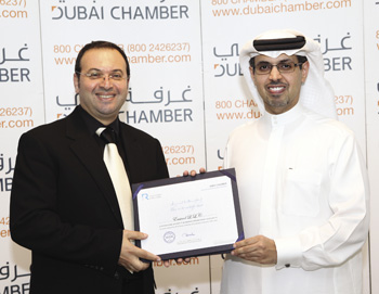 Adib Moubadder, CEO of Emicool, receiving the Dubai Chamber CSR Label certification from H.E. Hamad Buamim, Director General, Dubai Chamber