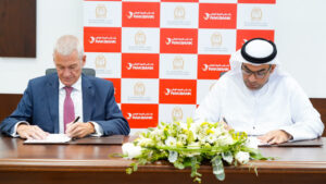 Peter England and H.E. Munther Mohammed Bin Shekar during the signing ceremony